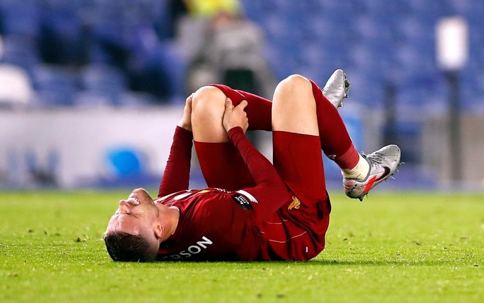 Jordan Henderson reacts after picking up an injury before going off during the Premier League match at the AMEX Stadium, Brighton - Liverpool captain Jordan Henderson to be assessed on Merseyside after injury scare in Brighton win - PA