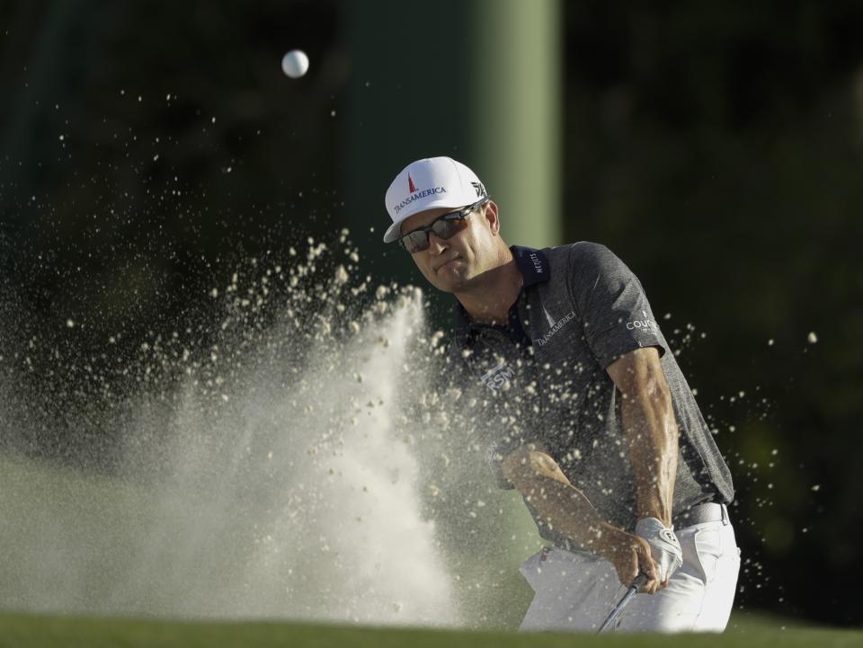 Zach Johnson hits on the 18th hole during the first round for the Masters golf tournament Thursday, April 11, 2019, in Augusta, Ga. (AP Photo/Marcio Jose Sanchez)