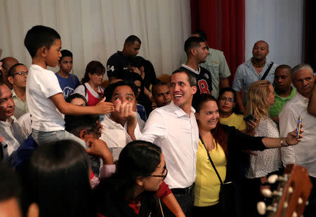 Venezuelan opposition leader Juan Guaido, who many nations have recognised as the country's rightful interim ruler, greets supporters in Maracay, Venezuela, April 26, 2019. REUTERS/Manaure Quintero