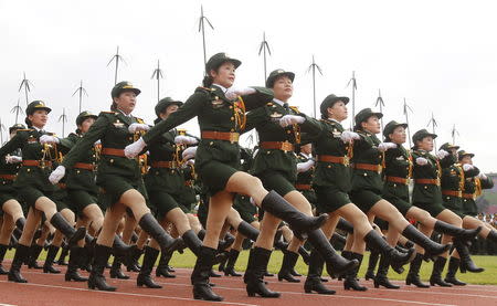 Vietnamese soldiers from a communication unit march during the 60th anniversary celebrations of the Dien Bien Phu battle in the historic city, in this May 7, 2014 file photo. REUTERS/Kham/Files