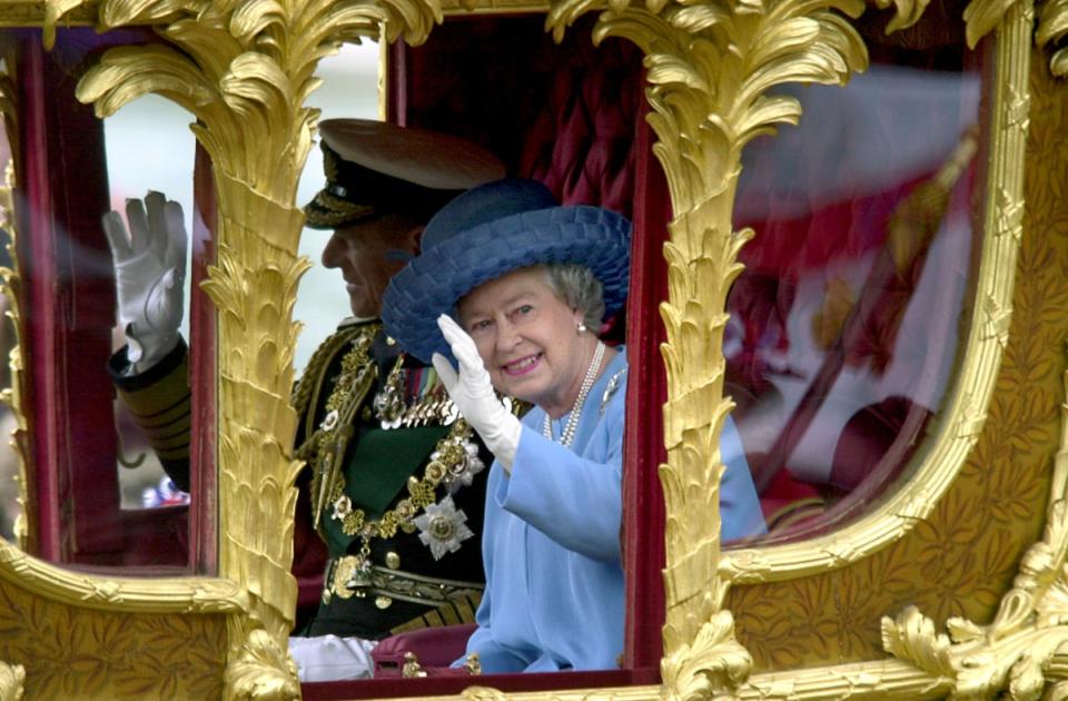 The Jubilee Queen in the Gold State Coach in 2002 (Rebecca Naden/PA) (PA Wire)