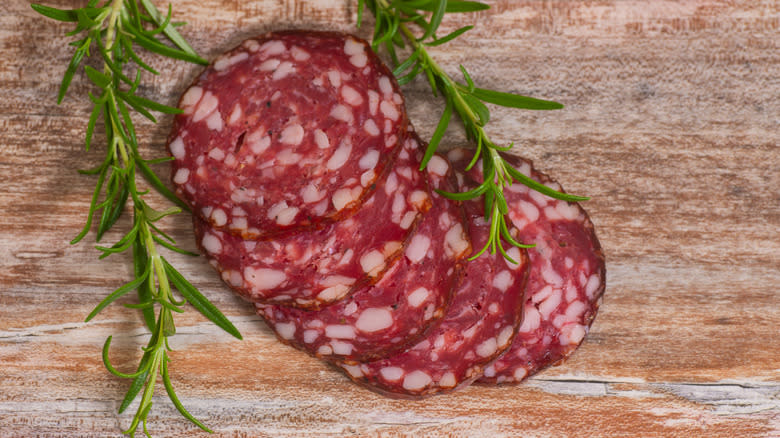 salami slices with rosemary
