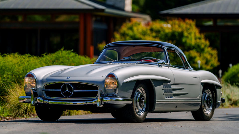 A fully restored 1962 Mercedes-Benz 300 SL Roadster, shown with its removable roof.