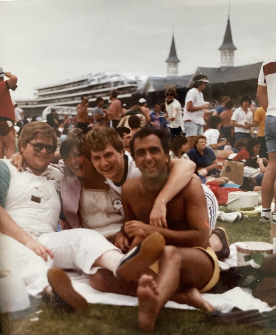 Marla Ridenour has some fun with Dayton pals in the 1983 Derby infield.