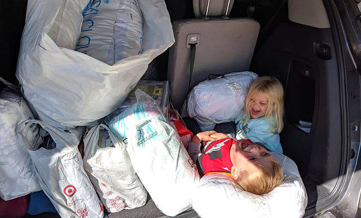 Tyler Sliz and his sister Addison with bedding supplies in their car trunk | Jackie Sliz