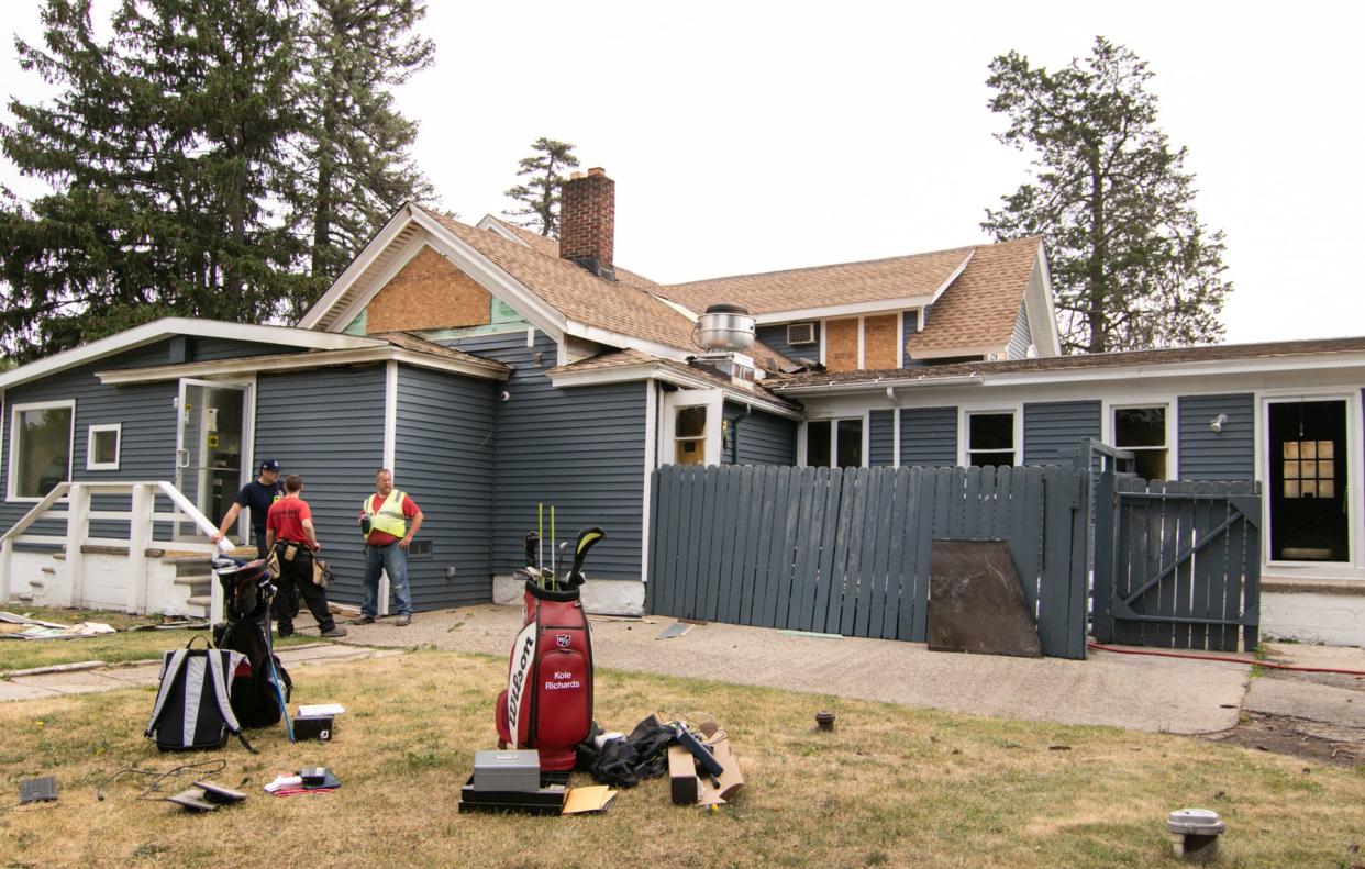 Brighton Area firefighters continue to investigate a fire that broke out sometime after 3 a.m. Friday, July 1, 2022, at Faulkwood Shores Golf Club on Hughes Road in Genoa Township.