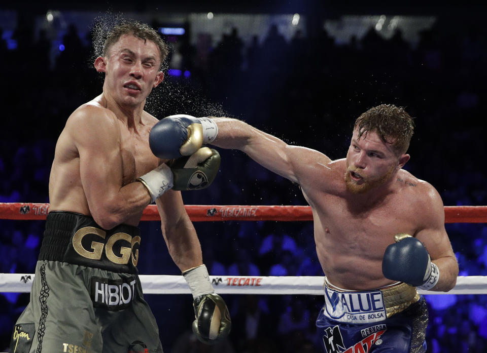 Canelo Alvarez, right, connects with a right to Gennady Golovkin during a middleweight title fight Saturday, Sept. 16, 2017, in Las Vegas. (AP)
