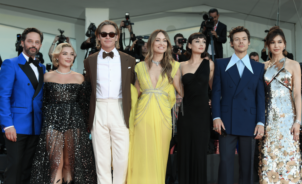 The cast of Don't Worry Darling pose for a group photo on the red carpet