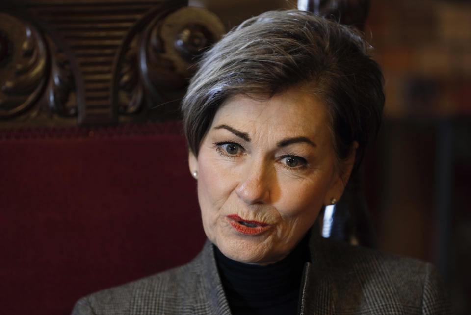 In this Nov. 7, 2019, photo Iowa Gov. Kim Reynolds speaks during an interview with The Associated Press in her formal office at the Statehouse in Des Moines, Iowa. For Reynolds, her drunken driving conviction nearly 20 years ago marked a turning point. Now, after becoming the state's first female governor, the Republican is using her experience as motivation for a stubborn campaign to restore the vote to felons that has divided her from many in her own party.(AP Photo/Charlie Neibergall)
