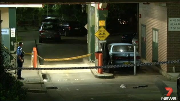 Police cordoned off the entrance to the apartment block on Belvoir Street. Photo: 7 News