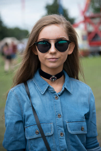 <p>Whether it was delicate lace or bold velvet, black chokers added a 90′s edge to any outfit, we saw them on anything from floaty, hippie dresses to sports luxe styles. <i>[Photo: Getty]</i> </p>