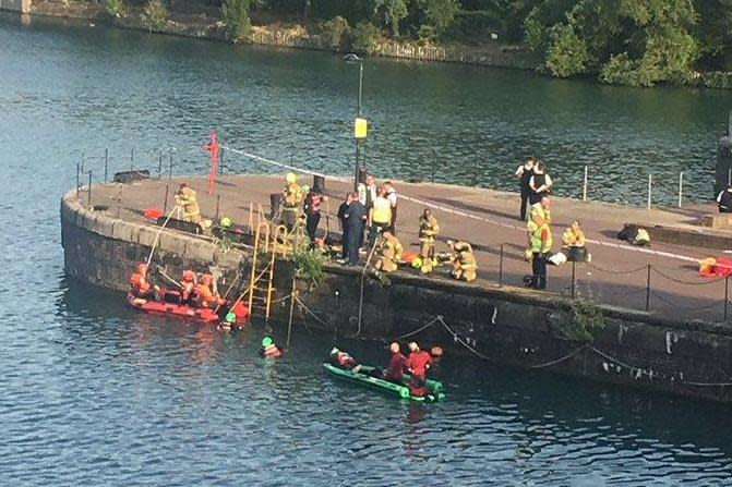 Emergency services at the scene at Shadwell Basin in Wapping, east London (Emma Reilly)