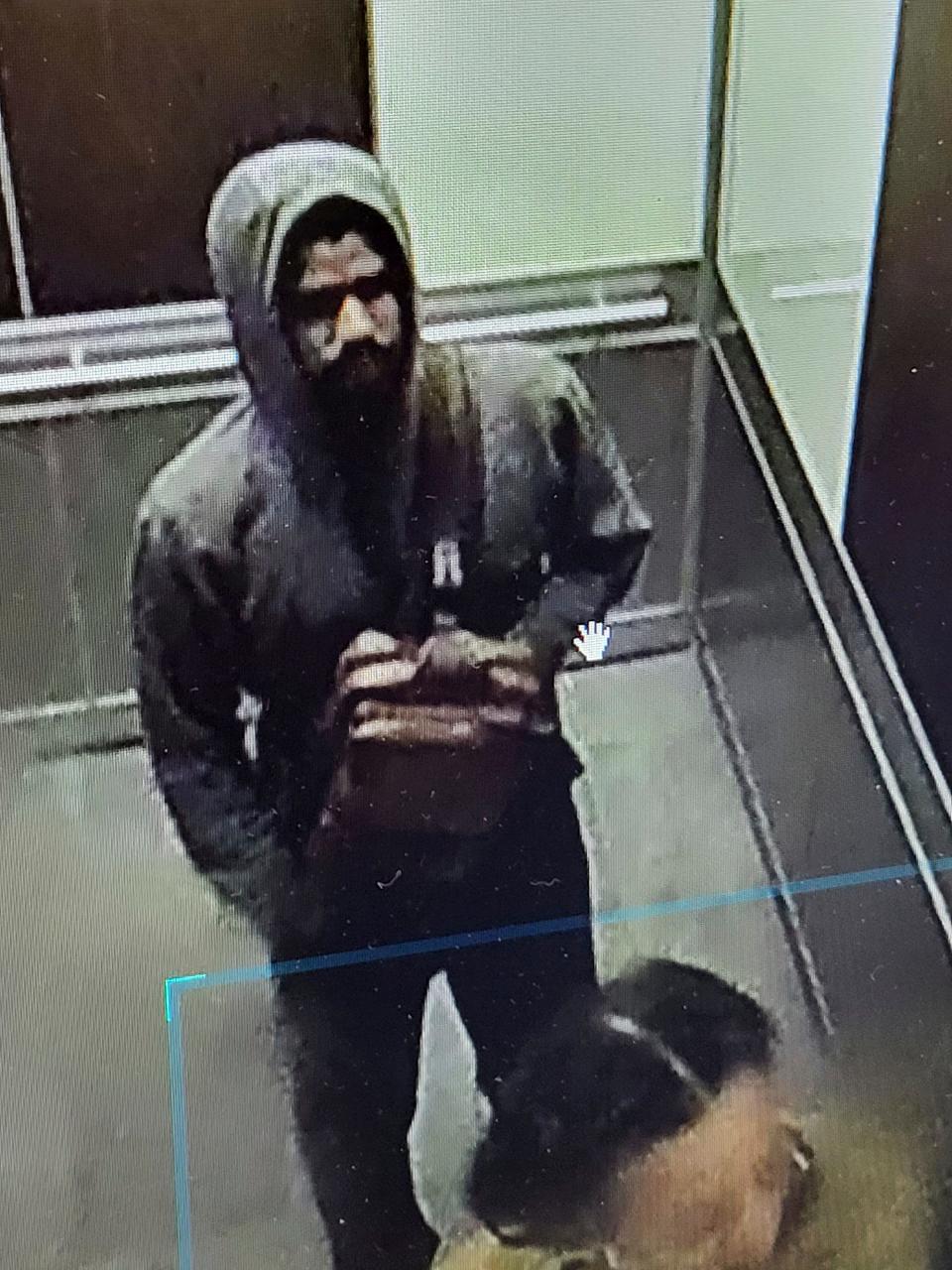 This photo released by the Atlanta Police Department of video footage on Wednesday, May 3, 2023, shows a suspected shooter. Police said Wednesday afternoon that they were investigating an “active shooter situation” in a building in Atlanta's Midtown neighborhood and that multiple people had been injured.