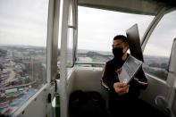 'Amusement Workation' lets teleworkers work from a Ferris wheel and pool side amid the coronavirus disease (COVID-19) outbreak, at Yomiuriland in Tokyo