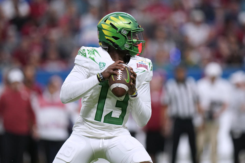 Oregon quarterback Anthony Brown (13) looks to throw a pass against Oklahoma during the first half of the Alamo Bowl NCAA college football game Wednesday, Dec. 29, 2021, in San Antonio. (AP Photo/Eric Gay)