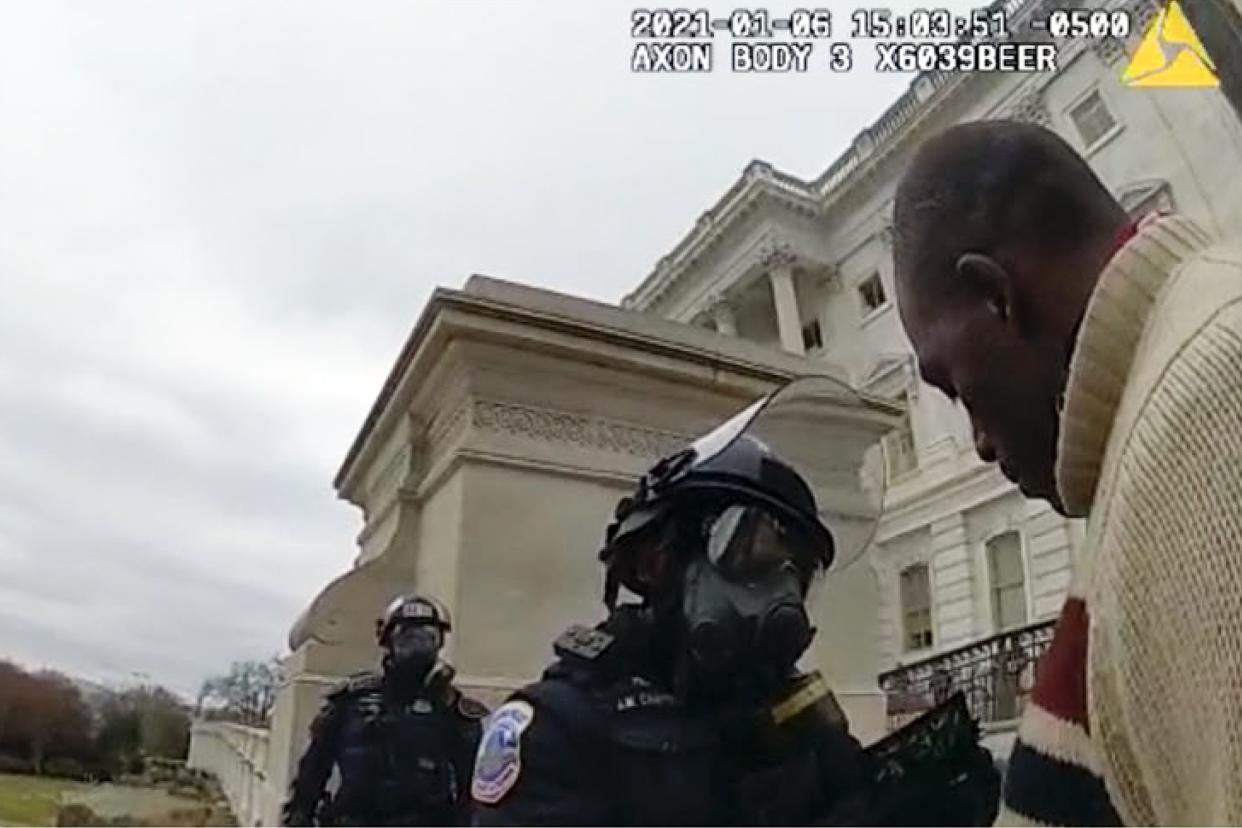 In this image from a Washington Metropolitan Police Department officer's body-worn video camera, and contained in the statement of facts supporting an arrest warrant for Mark Ponder, Ponder talks to police after being arrested on the West Front of the U.S. Capitol on Jan. 6, 2021, in Washington. 