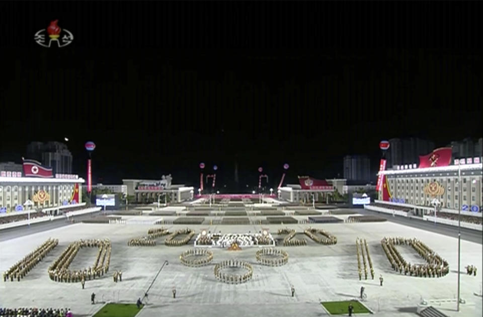 In this image made from video broadcasted by North Korea's KRT on Saturday, Oct. 10, 2020, a military parade is held in Pyongyang, North Korea. North Korea has held a massive military parade and public rally to celebrate the 75th anniversary of the country’s ruling party.(KRT via AP)