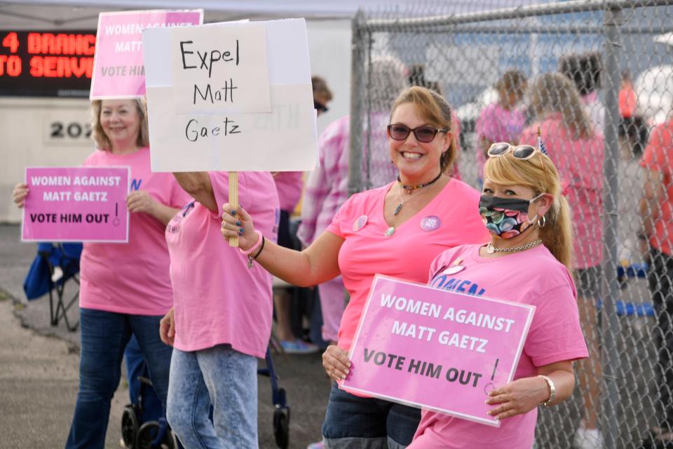 Michelle Foglia, right, and Michelle Hickerson were among about two dozen members of the group Women Against Matt Gaetz who gathered at the Okaloosa County School Board Administration building in Niceville on Tuesday to oppose the congressman's meeting with students at Niceville High School.