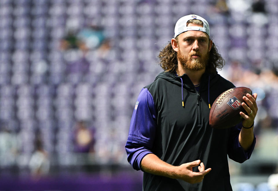 MINNEAPOLIS, MINNESOTA - AUGUST 10: T.J. Hockenson #87 of the Minnesota Vikings looks on as players warm up before the preseason game against the Las Vegas Raiders at U.S. Bank Stadium on August 10, 2024 in Minneapolis, Minnesota. (Photo by Stephen Maturen/Getty Images)