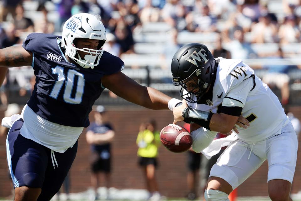 Sep 16, 2023; Norfolk, Virginia, USA; Old Dominion Monarchs defensive tackle Jalen Satchell (10) causing a Wake Forest Demon Deacons quarterback Mitch Griffis (12) to fumble during the first quarter at Kornblau Field at S.B. Ballard Stadium. Mandatory Credit: Peter Casey-USA TODAY Sports