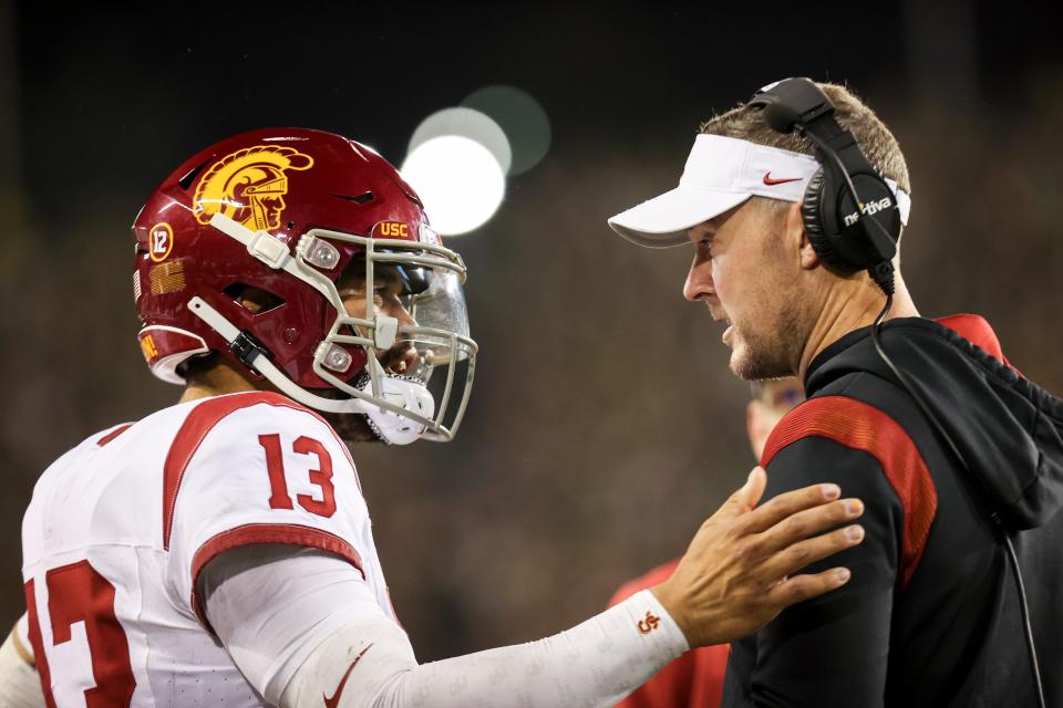 USC Trojans quarterback Caleb Williams (13) talks with USC Trojans head coach Lincoln Riley during the first half of the game against No. 6 Oregon Ducks on Saturday, Nov. 11, 2023, at Autzen Stadium in Eugene, Ore. Credit: Abigail Dollins-USA TODAY NETWORK