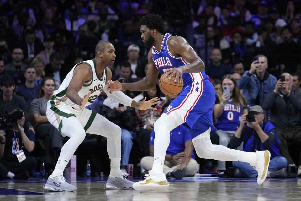 Philadelphia 76ers' Joel Embiid, right, tries to get past Boston Celtics' Al Horford during the second half of an NBA basketball game, Wednesday, Nov. 15, 2023, in Philadelphia. (AP Photo/Matt Slocum)