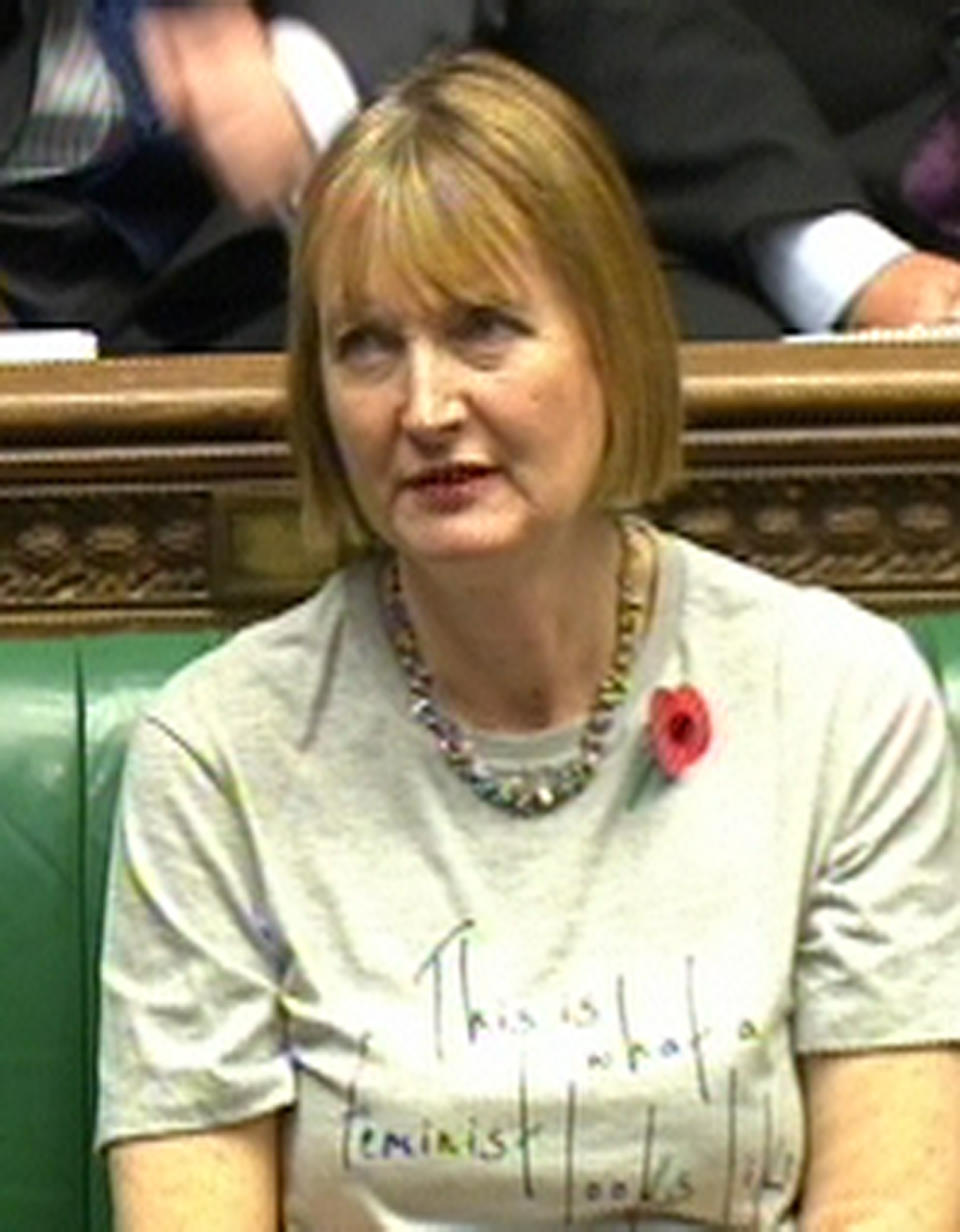 Deputy leader of the Labour party Harriet Harman wears a feminist T-shirt during Prime Minister's Questions in the House of Commons, London.