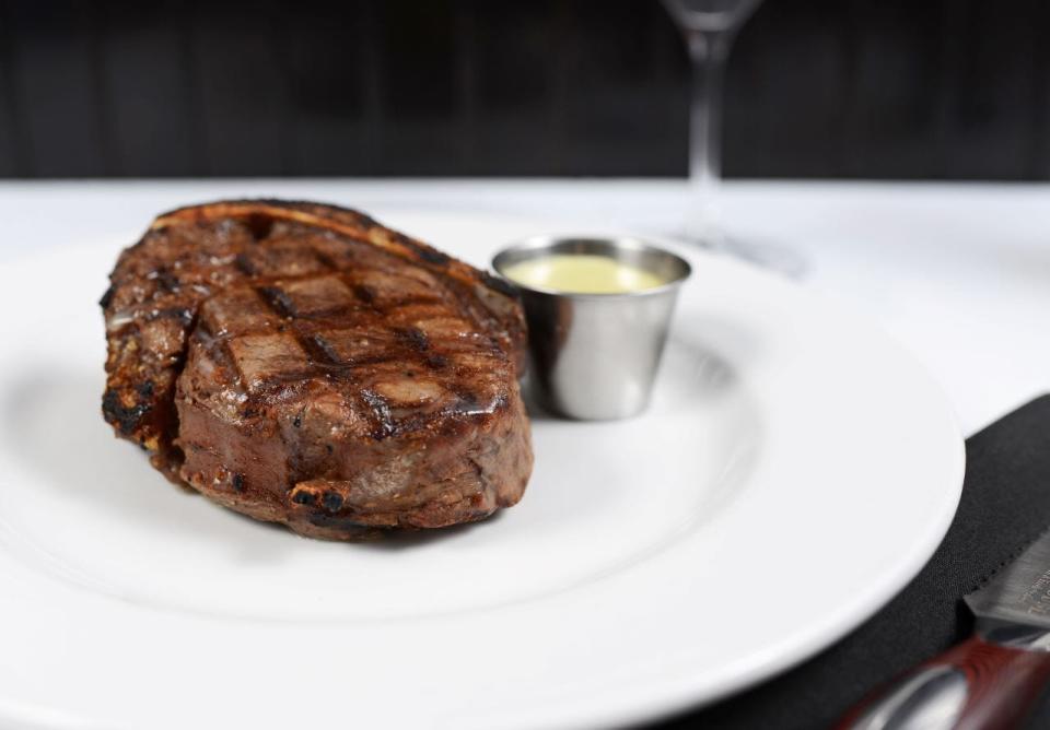 A bone-in filet mignon is served at Okeechobee Steakhouse in West Palm Beach.