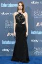 <p>Emma didn't go for her usual colours in a black Roland Mouret gown featuring a metallic bandana top. <i>[Photo: Getty]</i> </p>