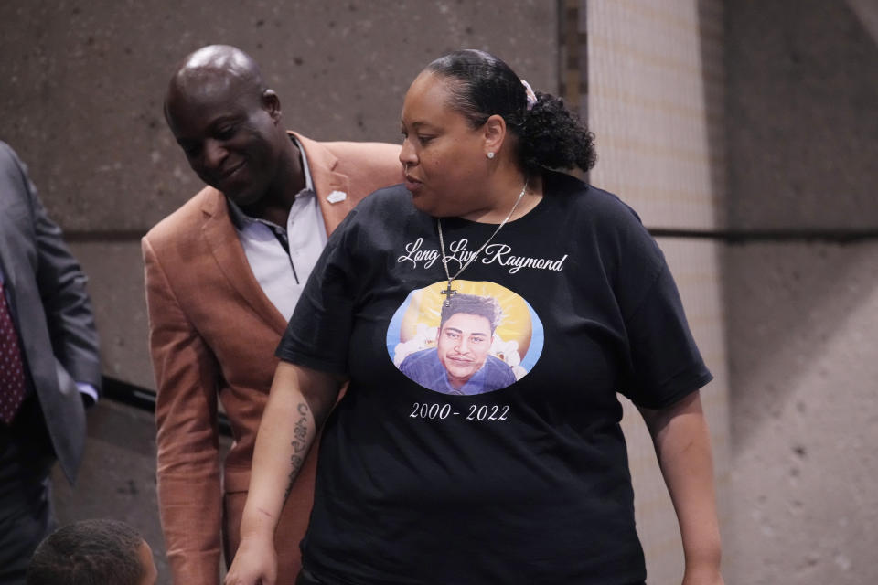 Adriana Vance, front, who lost her son, Raymond, in the massacre at Club Q, is consoled by Colorado Springs, Colo., Mayor Yemi Mobolade during a news conference after a hearing for the shooting suspect Monday, June 26, 2023, in Colorado Springs, Colo. The suspect pleaded guilty in the attack that left five people dead and wounded multiple others just before Thanksgiving Day 2022, at the longtime sanctuary for the LGBTQ+ community in this mostly conservative city. (AP Photo/David Zalubowski)