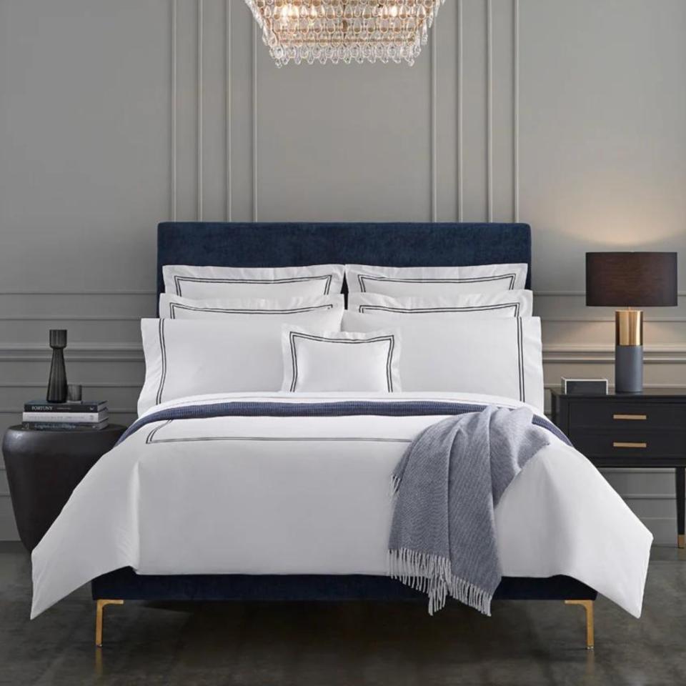 Sferra Grande Hotel Collection on a bed.