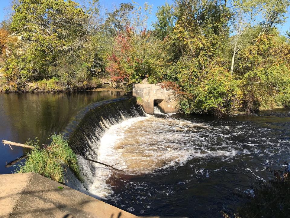 The Pawcatuck River tumbles about 10 feet over a dam that once created waterpower for an old mill.