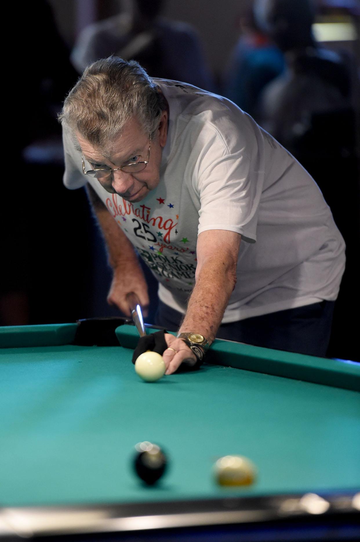 Ben Davis plays 9-ball at Wally's during the Polk Senior Games in Lakeland, Fl on Tuesday March 7, 2017.   [SCOTT WHEELER/THE LEDGER]