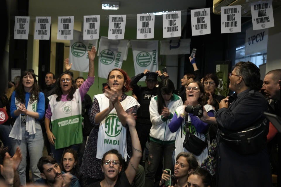 State workers, some who have been laid off, protest against the dismissal of state employees, inside the National Institute against Discrimination, Xenophobia, and Racism in Buenos Aires, Argentina, Wednesday, April 3, 2024. According to the State Workers Association, more than 11 thousand dismissals of state employees have been carried out by Javier Milei’s government. (AP Photo/Natacha Pisarenko)