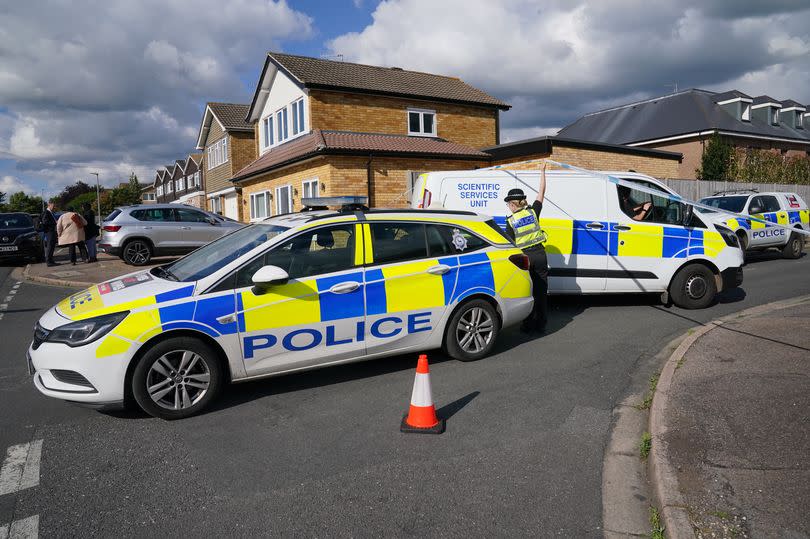 A view of the scene in Ashlyn Close, Bushey, Hertfordshire, where the wife and two daughters of a BBC sports commentator have been killed in a crossbow attack at their home.