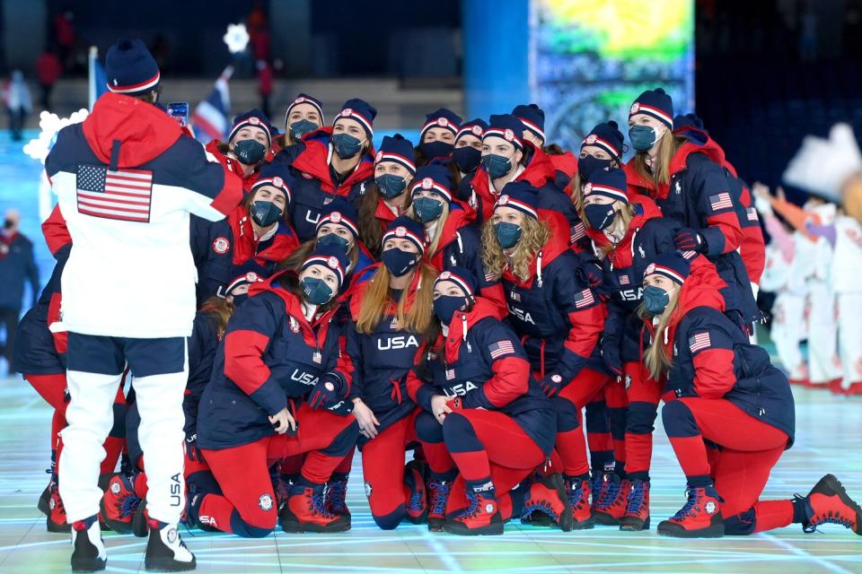 Members of Team United States pose for a photograph during the Opening Ceremony of the Beijing 2022 Winter Olympics