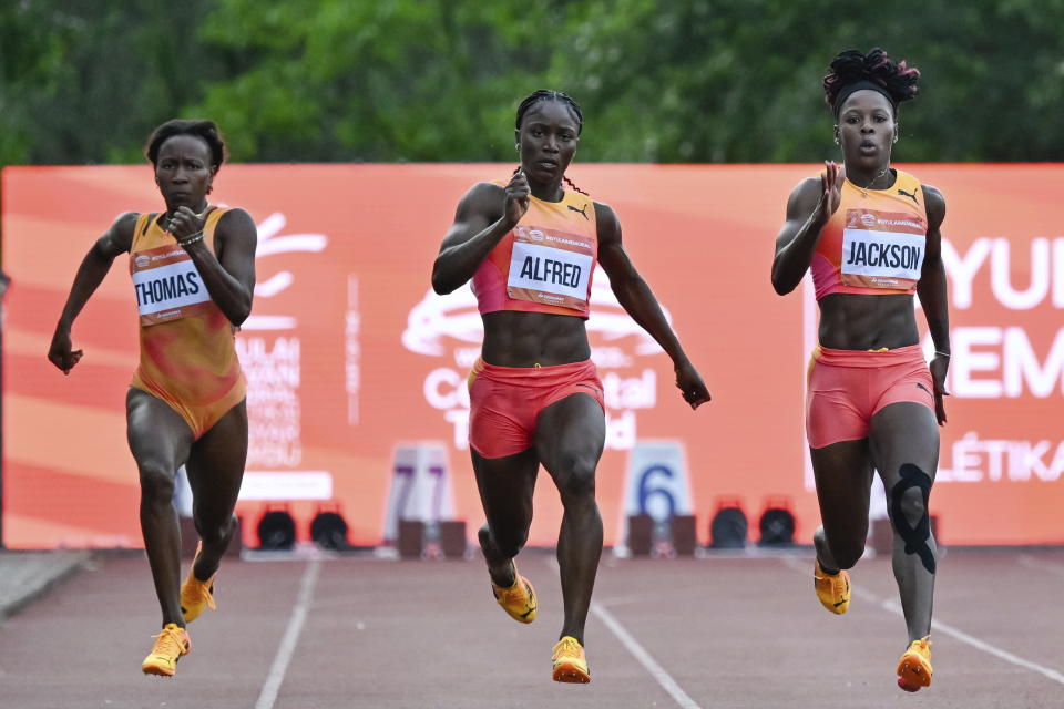 Lanea-Tava Thomas, left, of Jamaica, Julien Alfred, center, of Saint Lucia, and Shericka Jackson, right, of Jamaica, compete in the 200 meter event at the Gyulai Istvan Memorial Track and Field Hungarian Grand Prix in Szekesfehervar, Hungary, Tuesday, July 9, 2024. Julien Alfred, center, of Saint Lucia, won the race. (Tamas Vasvari/MTI via AP)