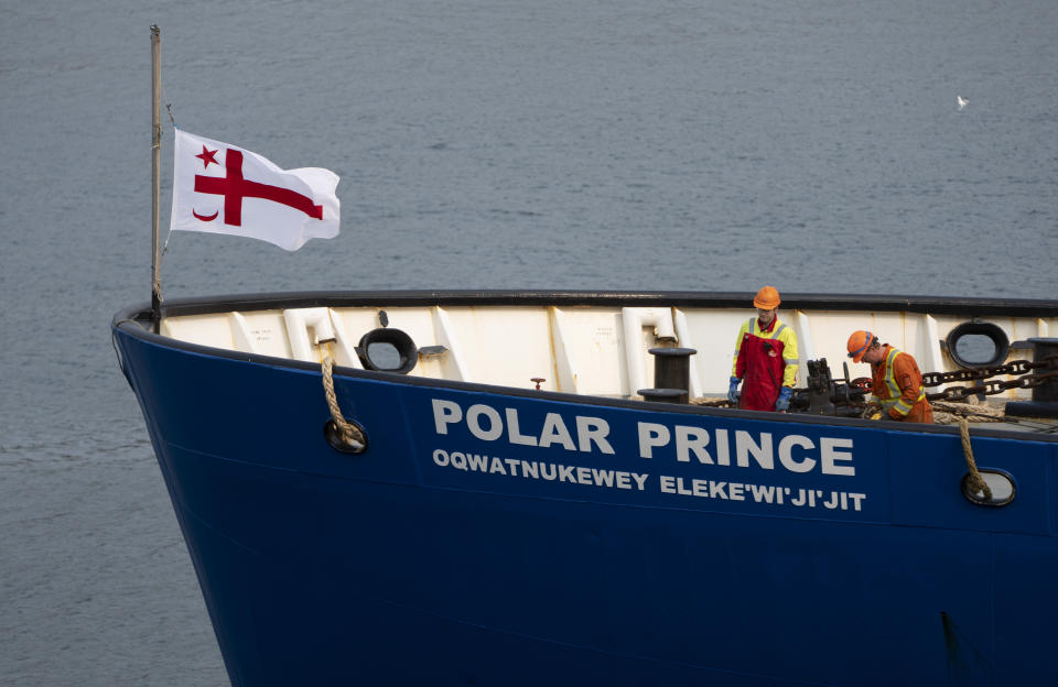 Crew members of the Polar Prince prepare to dock the ship as it arrives at the Coast Guard wharf in on Saturday, June 24, 2023 in St. John's, Newfoundland. Authorities from the U.S. and Canada began the process of investigating the cause of the fatal Titan submersible implosion even as they grappled with questions of who was responsible for determining how the tragedy unfolded. (Adrian Wyld /The Canadian Press via AP)