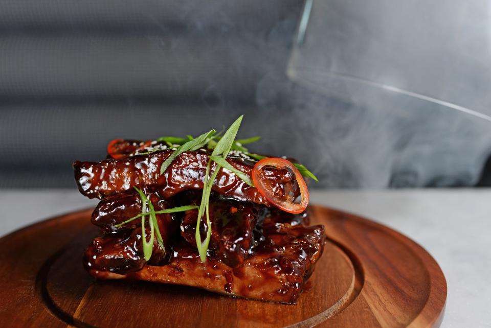 Szechuan ribs, presented in a smoky glass dome tableside, are on the menu at the upcoming Blackbird restaurant in Jupiter.