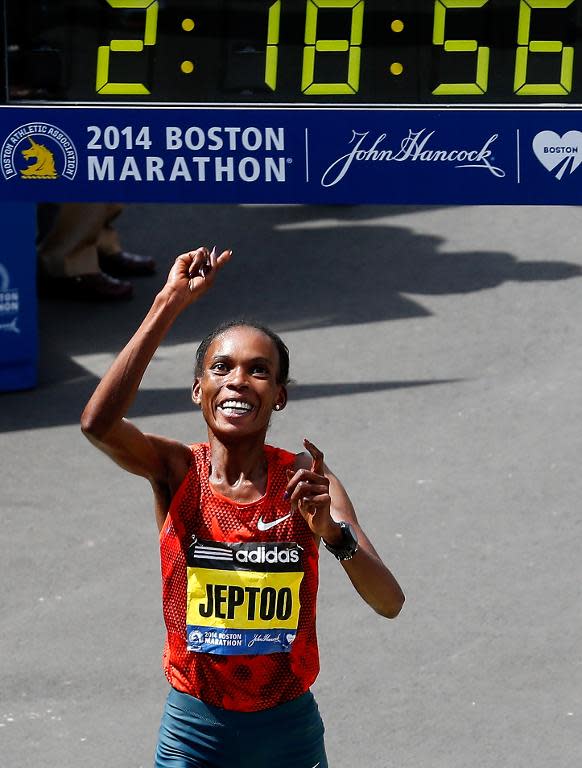 Rita Jeptoo of Kenya crosses the finish line to win the 118th Boston Marathon on April 21, 2014 in Boston, Massachusetts