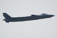 A J-20 stealth fighter jet of the Chinese People's Liberation Army (PLA) Air Force performs during the 13th China International Aviation and Aerospace Exhibition, also known as Airshow China 2021, on Tuesday, Sept. 28, 2021 in Zhuhai in southern China's Guangdong province. (AP Photo/Ng Han Guan)