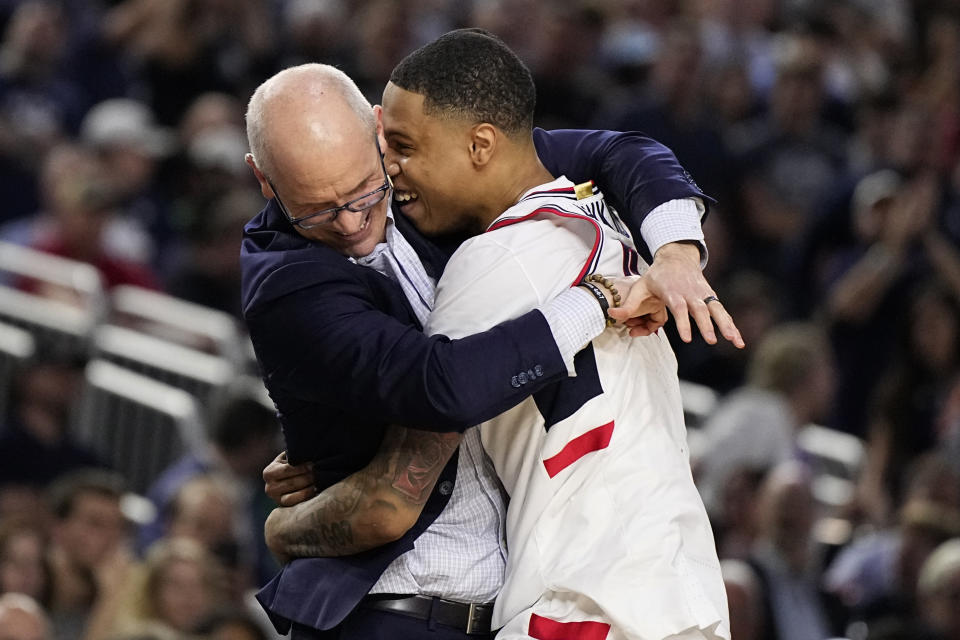 Connecticut guard Jordan Hawkins celebrates with head coach Dan Hurley during the second half of the men's national championship college basketball game against San Diego State in the NCAA Tournament on Monday, April 3, 2023, in Houston. (AP Photo/Brynn Anderson)