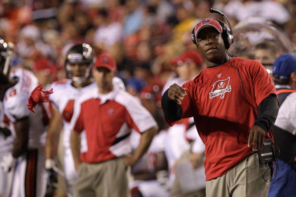 LANDOVER, MD - SEPTEMBER 01: Head coach Raheem Morris throws out the challenge flag during the first half of a preseason game against the Washington Redskins at FedExField on September 1, 2011 in Landover, Maryland.  (Photo by Rob Carr/Getty Images)