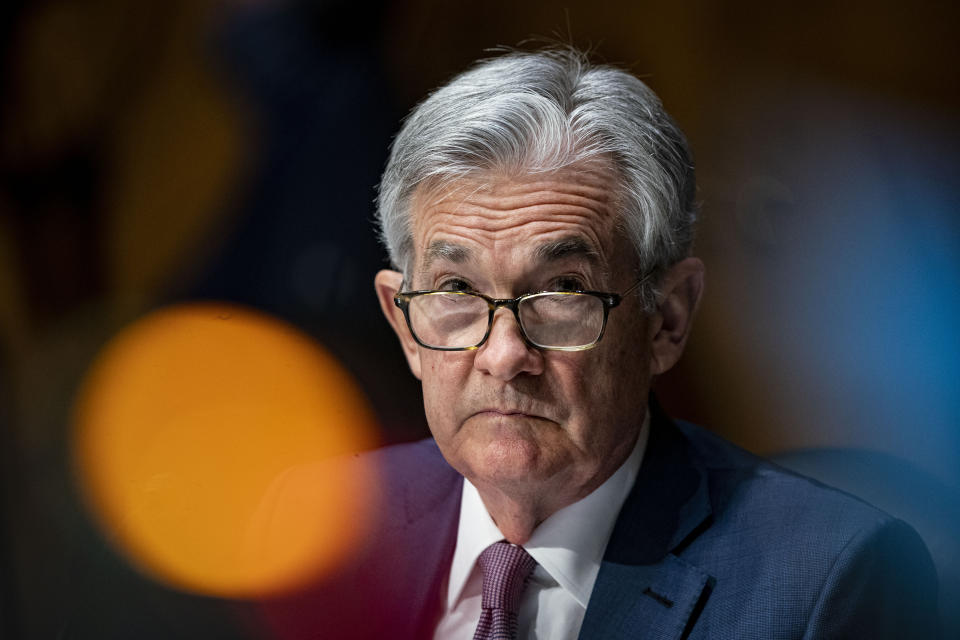 FILE - In this Dec. 1, 2020 file photo, Federal Reserve Chair Jerome Powell listens during a Senate Banking Committee hearing on Capitol Hill in Washington.  Federal Reserve officials were convinced last month that the U.S. economy and job growth had slowed as coronavirus cases surged across the country. They noted that the economy's outlook is heavily dependent on the course of the virus.   (Al Drago/The New York Times via AP, Pool)