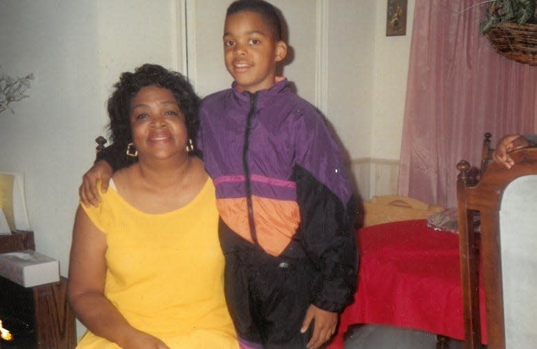 Seven-year-old Andre Emmett, right, sits with his grandmother, Alice Oliver, as seen in 1990 . "She was Dre's go-to mom," Emmett's mom, Regina Oliver, says about the two's relationship.