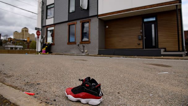PHOTO: A shoe is seen outside a Pittsburgh Airbnb apartment rental, April 17, 2022, following a shooting during a house party. (Jeff Swensen/Getty Images)