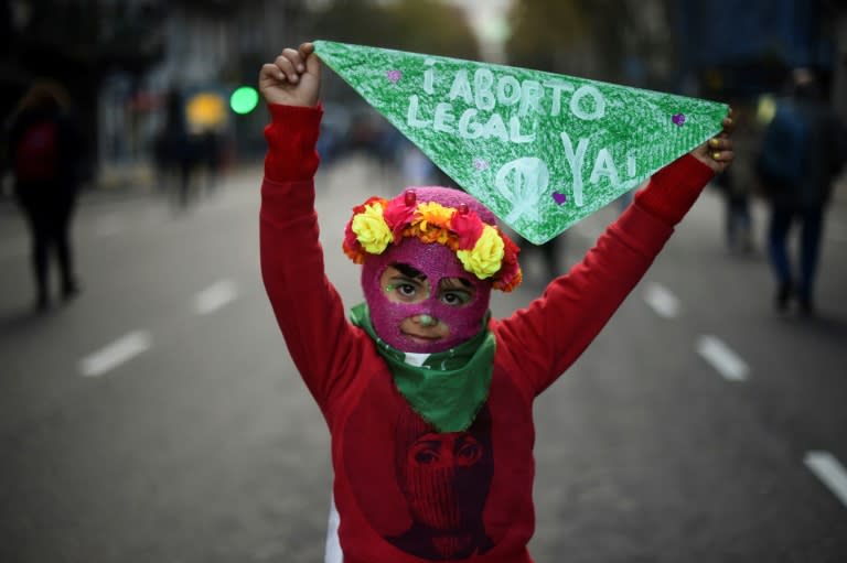 A young girl takes part in a June 2018 march in Buenos Aires against violence towards women and for abortion rights