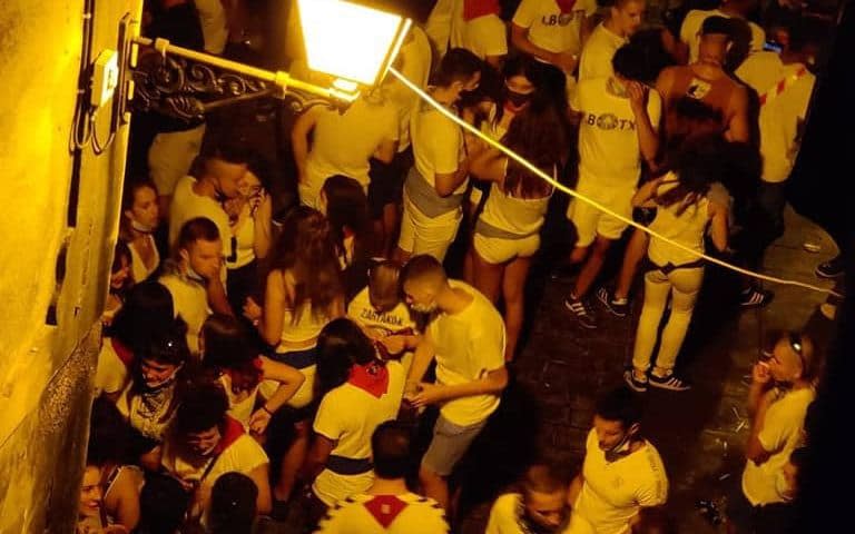 More than 400 young people from the streets of Tafalla, Navarre, Spain, where they had gathered after a coronavirus 'no parties' lockdown was announced
