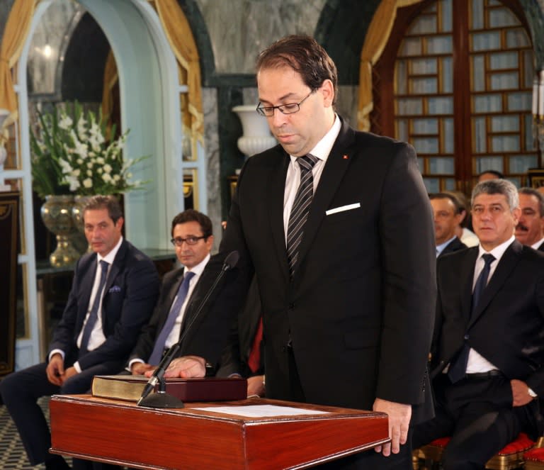 Tunisia's new Prime Minister Youssef Chahed takes the oath of office, during the country's new government swearing-in ceremony at Carthage Palace near the capital Tunis on August 27, 2016