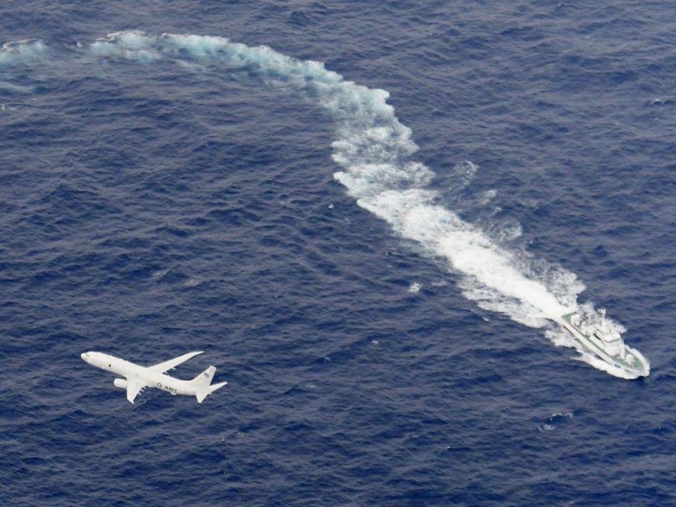 A Japan Coast Guard patrol vessel and US Navy aeroplane conduct search and rescue operation at the area where two US Marine Corps aircraft have been involved in a mishap in the skies, off the coast of Kochi prefecture, Japan (REUTERS)